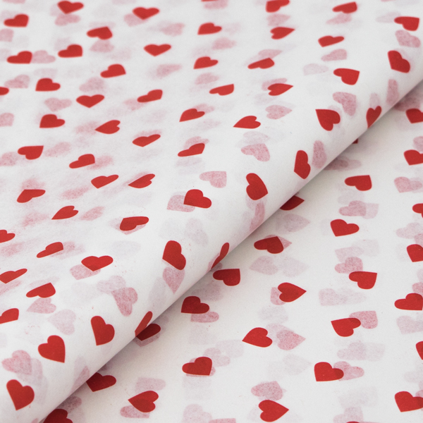 Hearts Patterned Tissue Paper from stock at Midpac Packaging. White Tissue Paper printed with a red heart pattern across each sheet